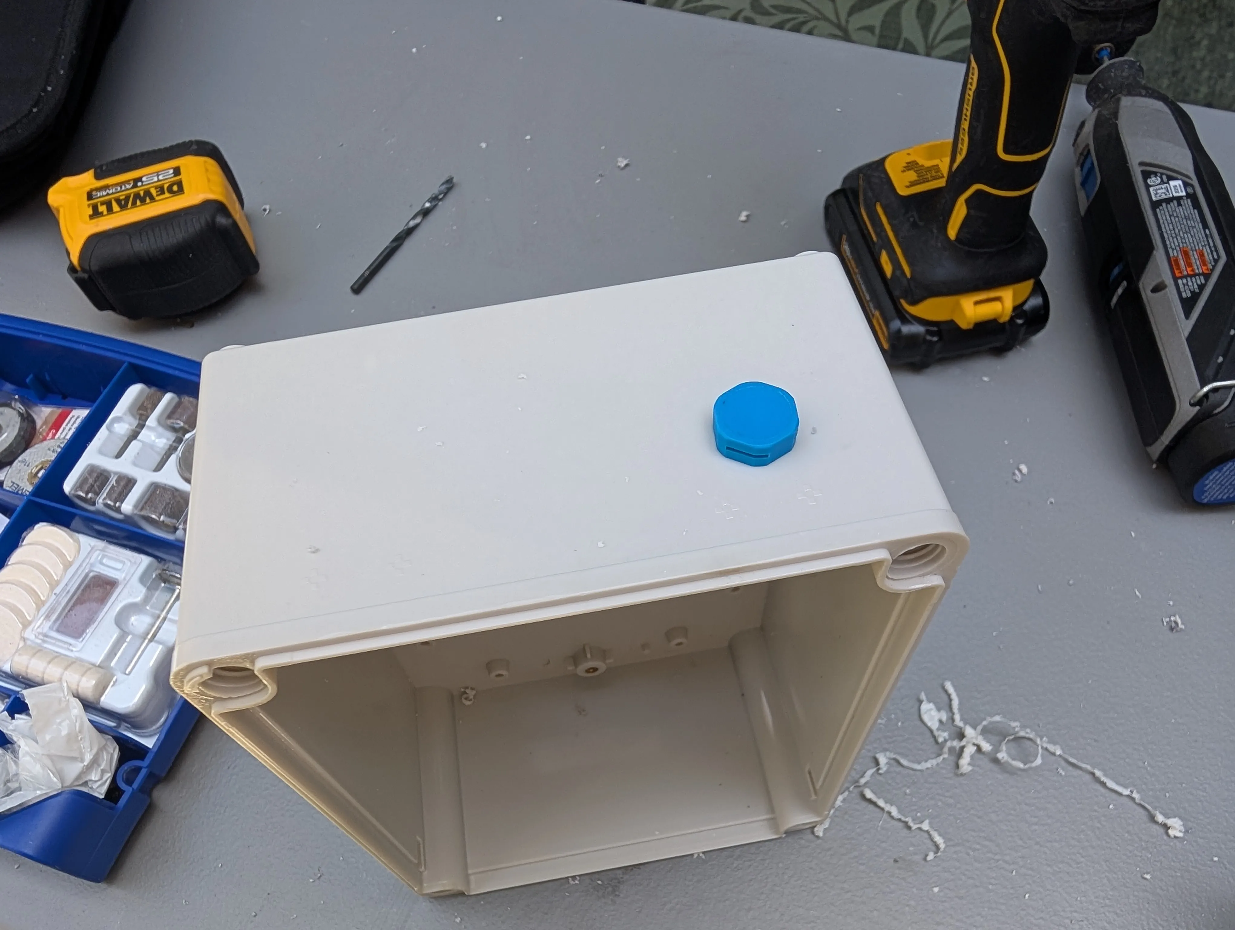 Breather Valve Installation - Blue breather valve installed to prevent moisture buildup while allowing pressure equalization