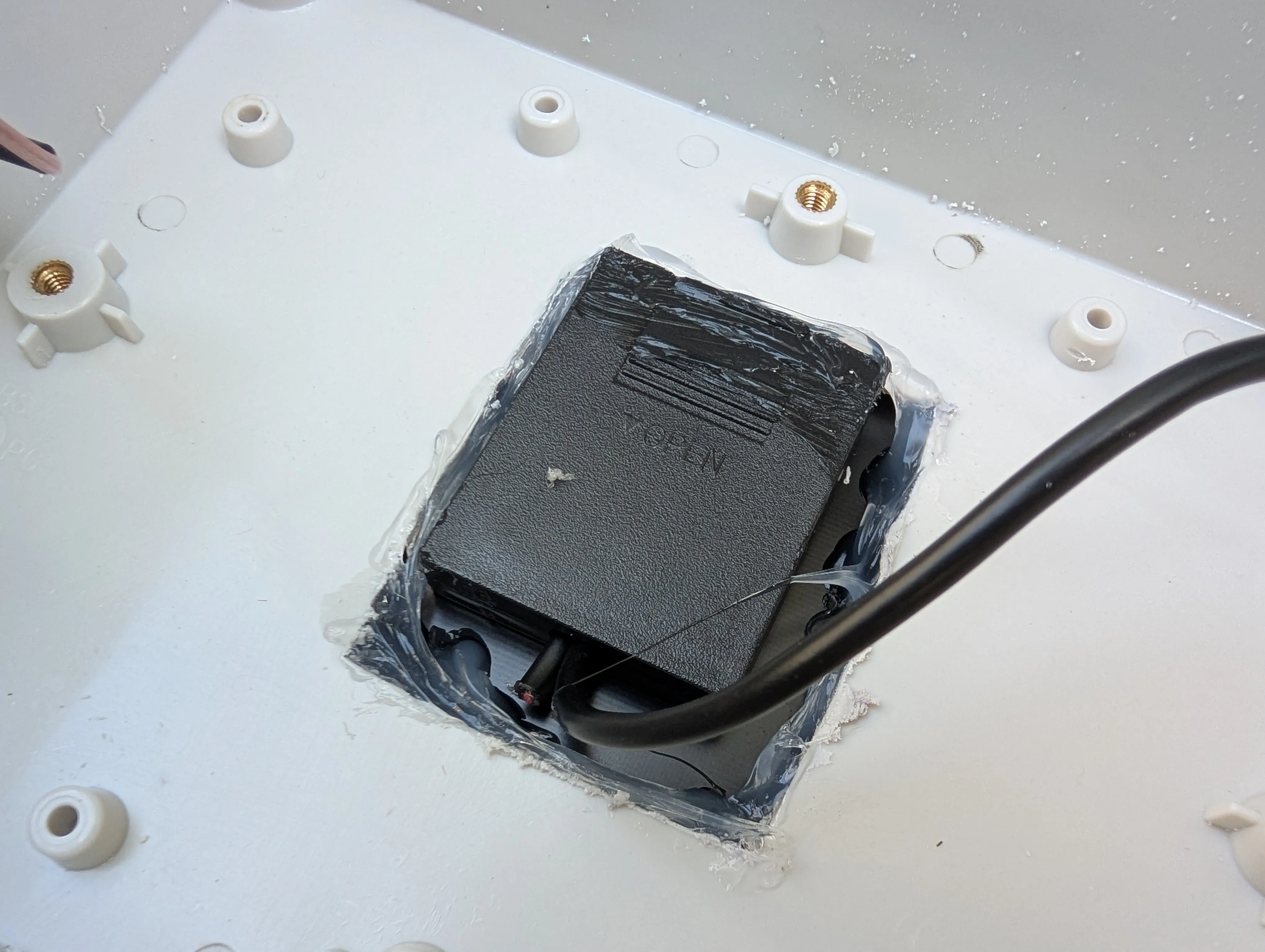 Meshtastic Board Installation - Meshtastic board with built-in battery compartment and wiring harness installed in enclosure base